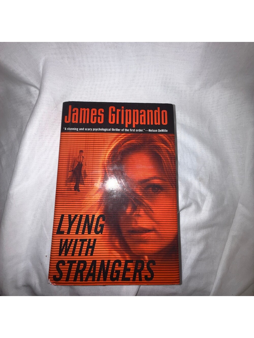Lying with Strangers by James Grippando